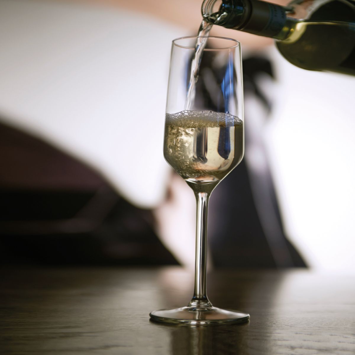 Atmosphärischer Rahmen mit gefüllter Carre-Champagnerglas 22 cl.